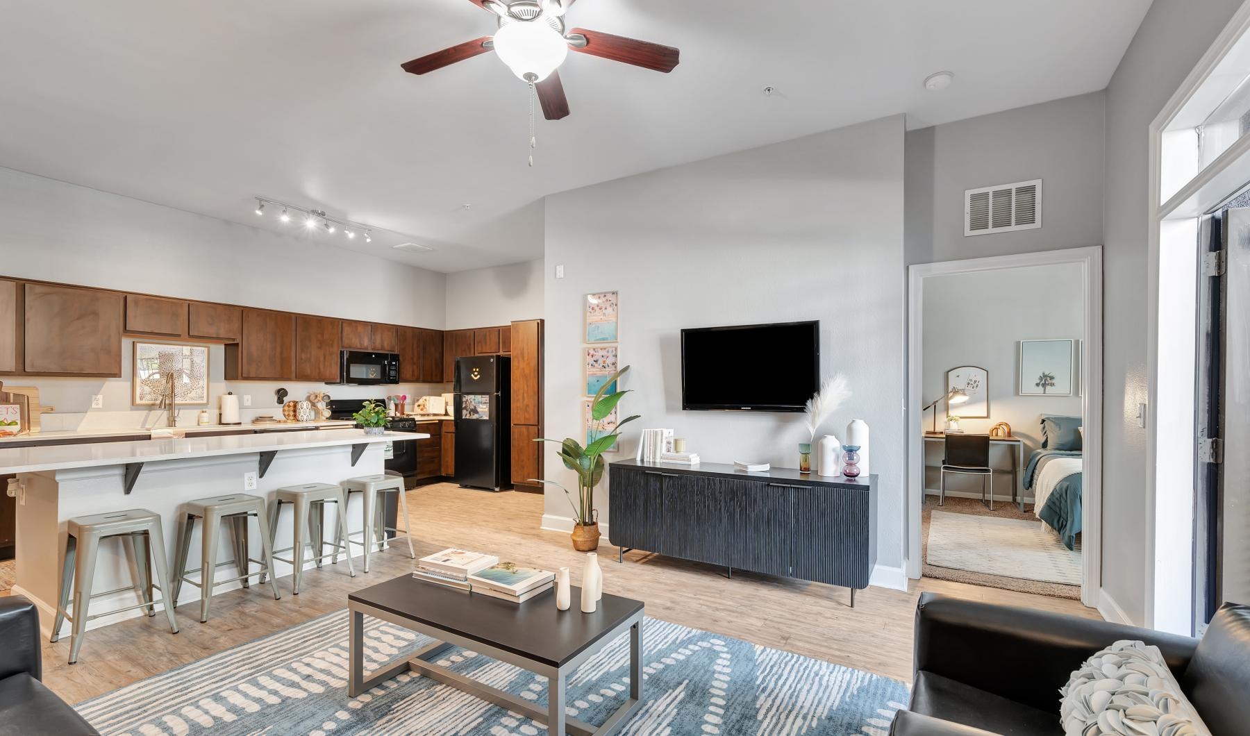 a living room with a tv and a table