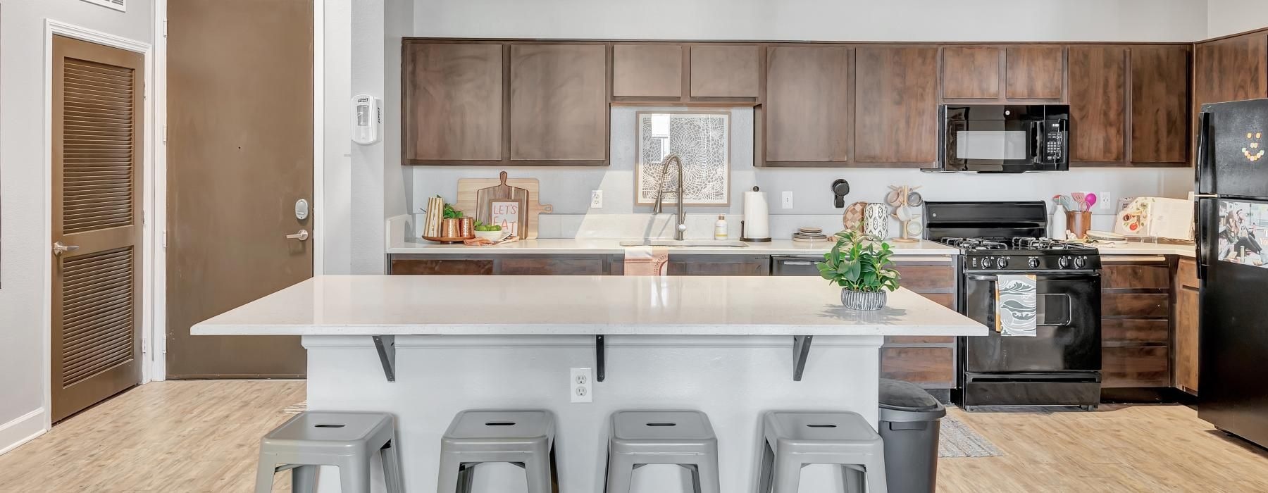 a kitchen with a marble island