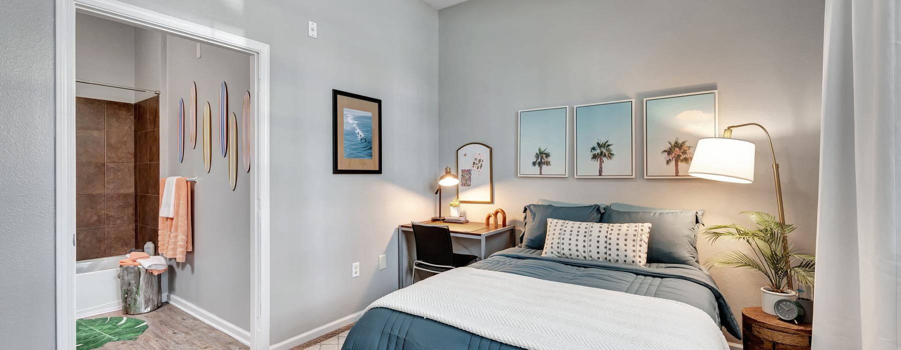 a bedroom with a bed and a fan